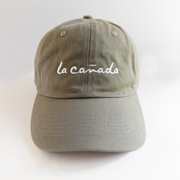 Khaki baseball hat with 'la cañada' lettering
