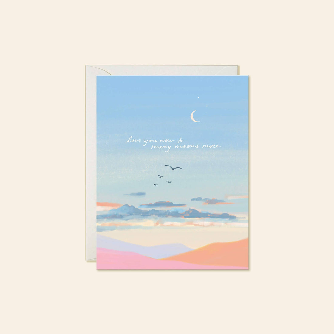 A greeting card featuring a blue sky with a crescent moon, birds, clouds, and the handwritten text 'Love you now & many moons more".