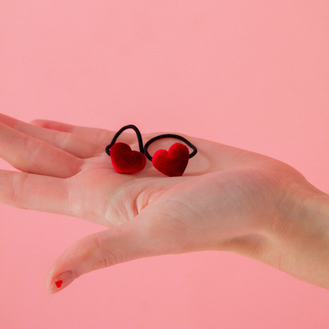Red heart-shaped hair ties 