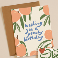 Greeting card with peach design and 'wishing you a peachy birthday' text