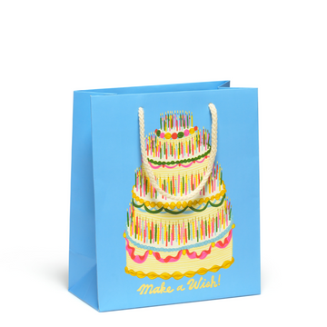 Blue birthday gift bag with colorful cake and message that says Make A Wish!