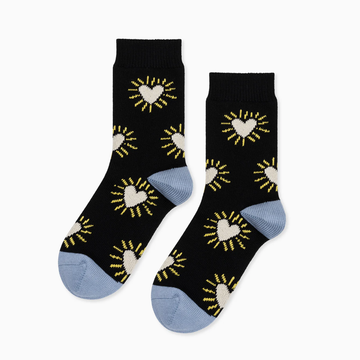 black crew socks with white hearts and with a blue toe and heel