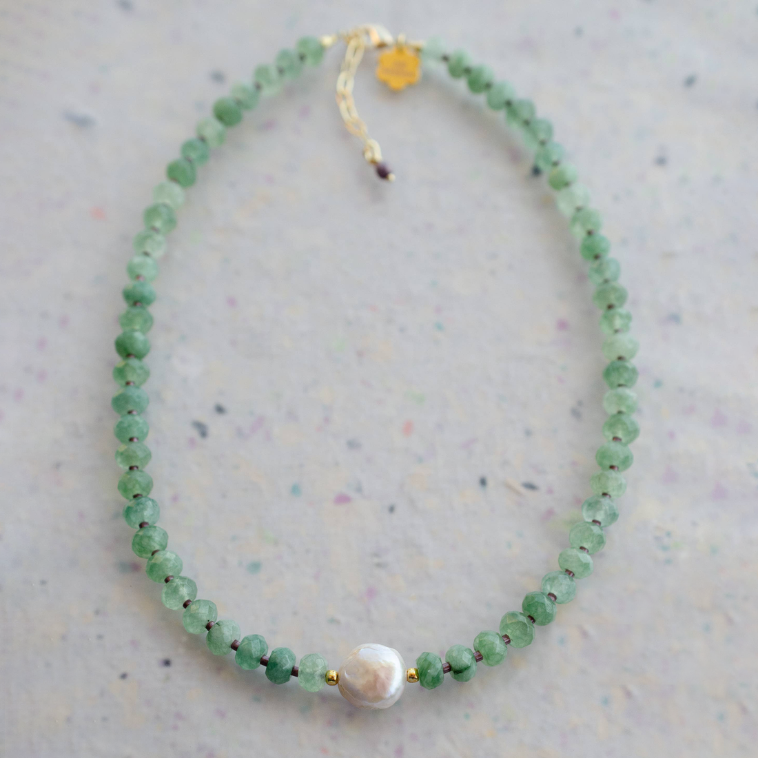 sage beaded necklace with a mother of pearl