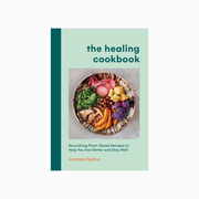 Book cover of 'The Healing Cookbook' with a plate of food on a light green background
