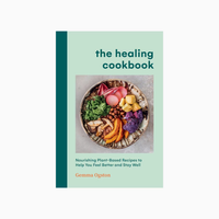 Book cover of 'The Healing Cookbook' with a plate of food on a light green background
