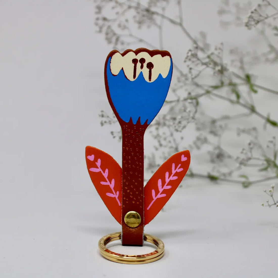 burnt orange and blue tulip leather keychain