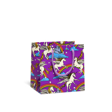 small purple gift bag with unicorns and rainbows