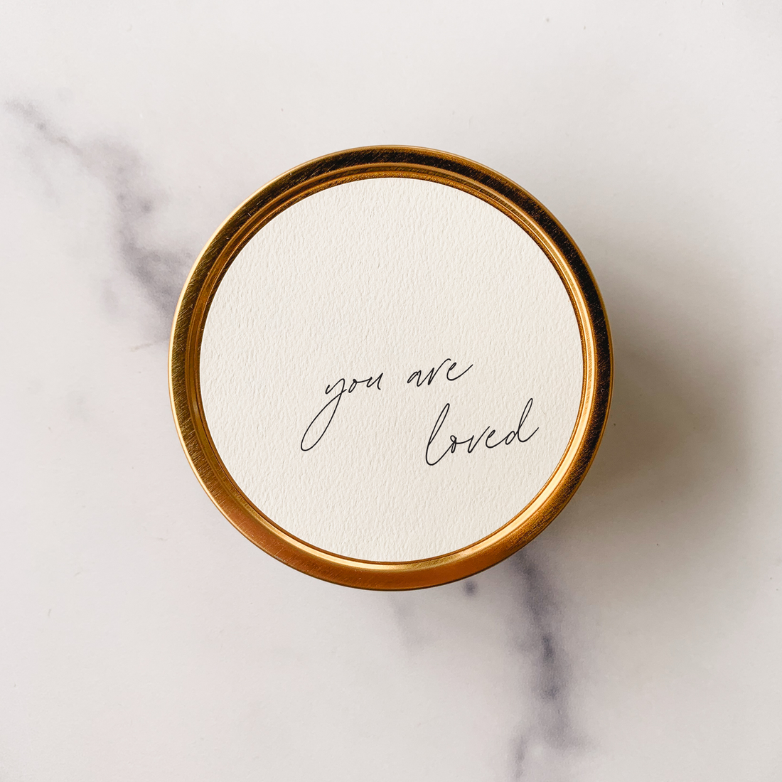 Travel candle with "You Are Loved" on tin